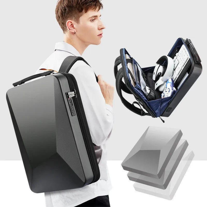 Men's titanium silver hard shell laptop backpack with lock, showing front view and organiser pockets.