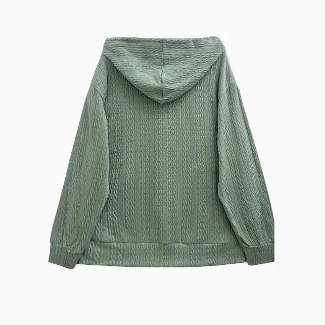 Forest green women's loose-fit hooded zip-up sweater coat on a hanger, showing front zip and long sleeves.