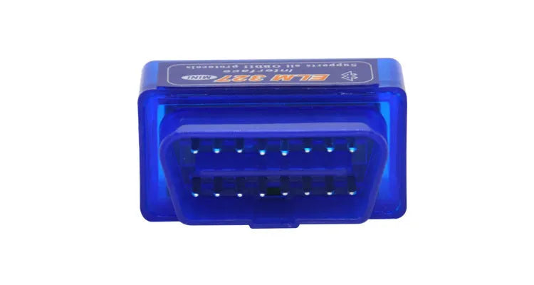 Small black ELM327 Bluetooth OBD2 diagnostic scanner plugged into a car's port.