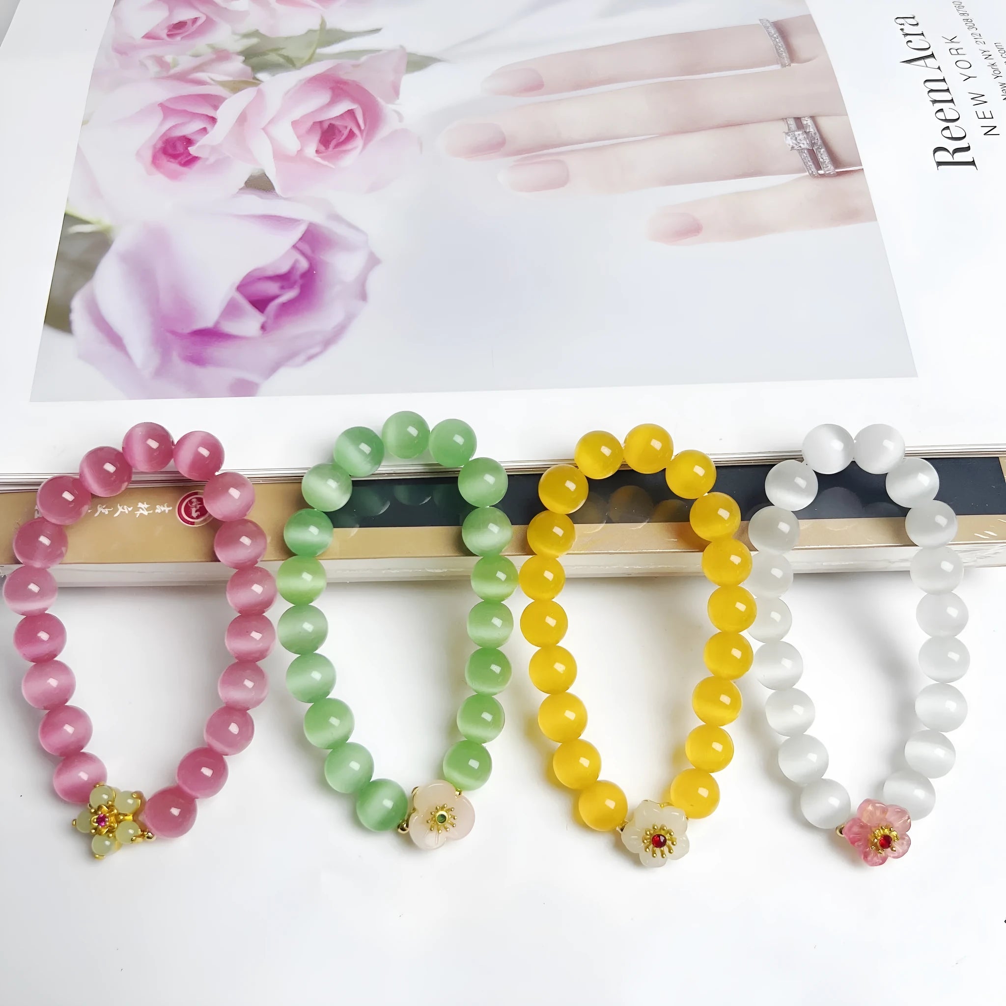 Handmade glass bracelet with flower beads in yellow, pink, white, green colours