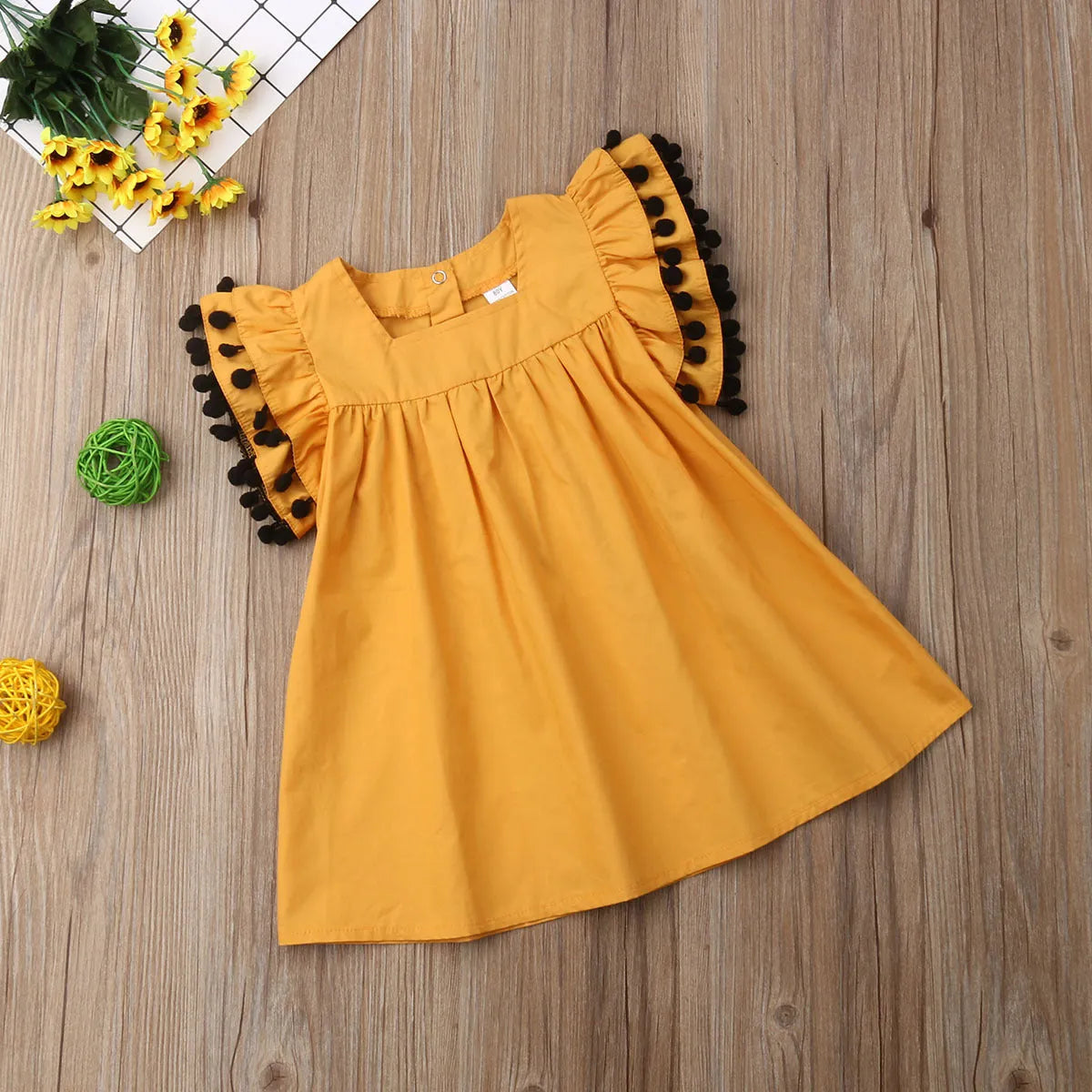 Orange sleeveless summer dress for girls available in sizes 12M through 5T