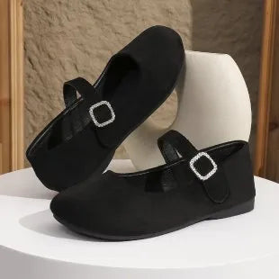 Women's solid black casual flat fisherman shoes with canvas upper and rubber sole.