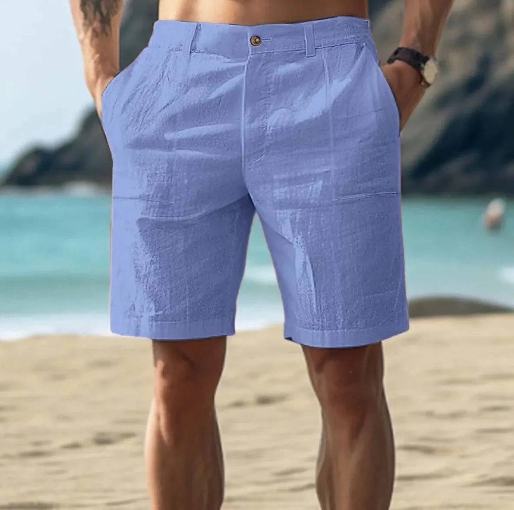 Men's solid colour cotton casual trousers with mid-length legs and a button-fly front closure.