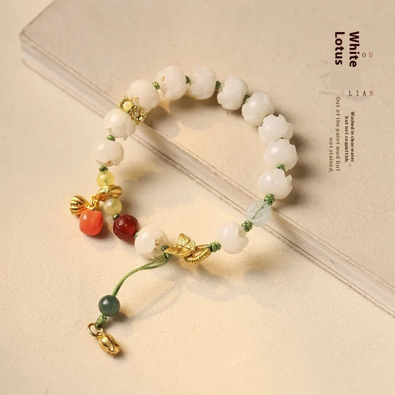 White jade Bodhi bracelet with lotus and pumpkin beads on open rope with ring clasp