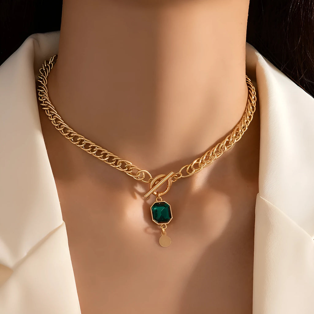 Gold geometric zircon pendant necklace with Cuban chain on white background