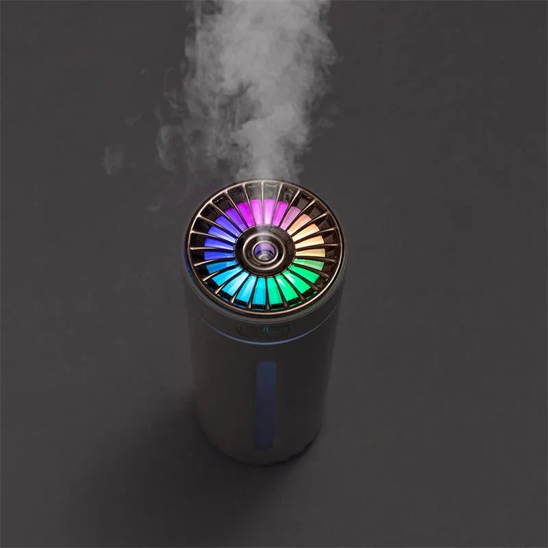 Black USB rechargeable car humidifier with colourful lights showing mist output, sized for cup holders