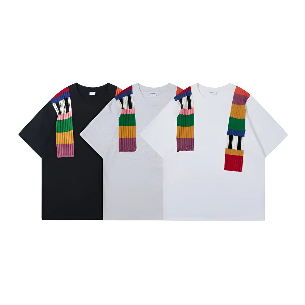 Men's loose grey cotton T-shirt with black and white patchwork letter design on chest.