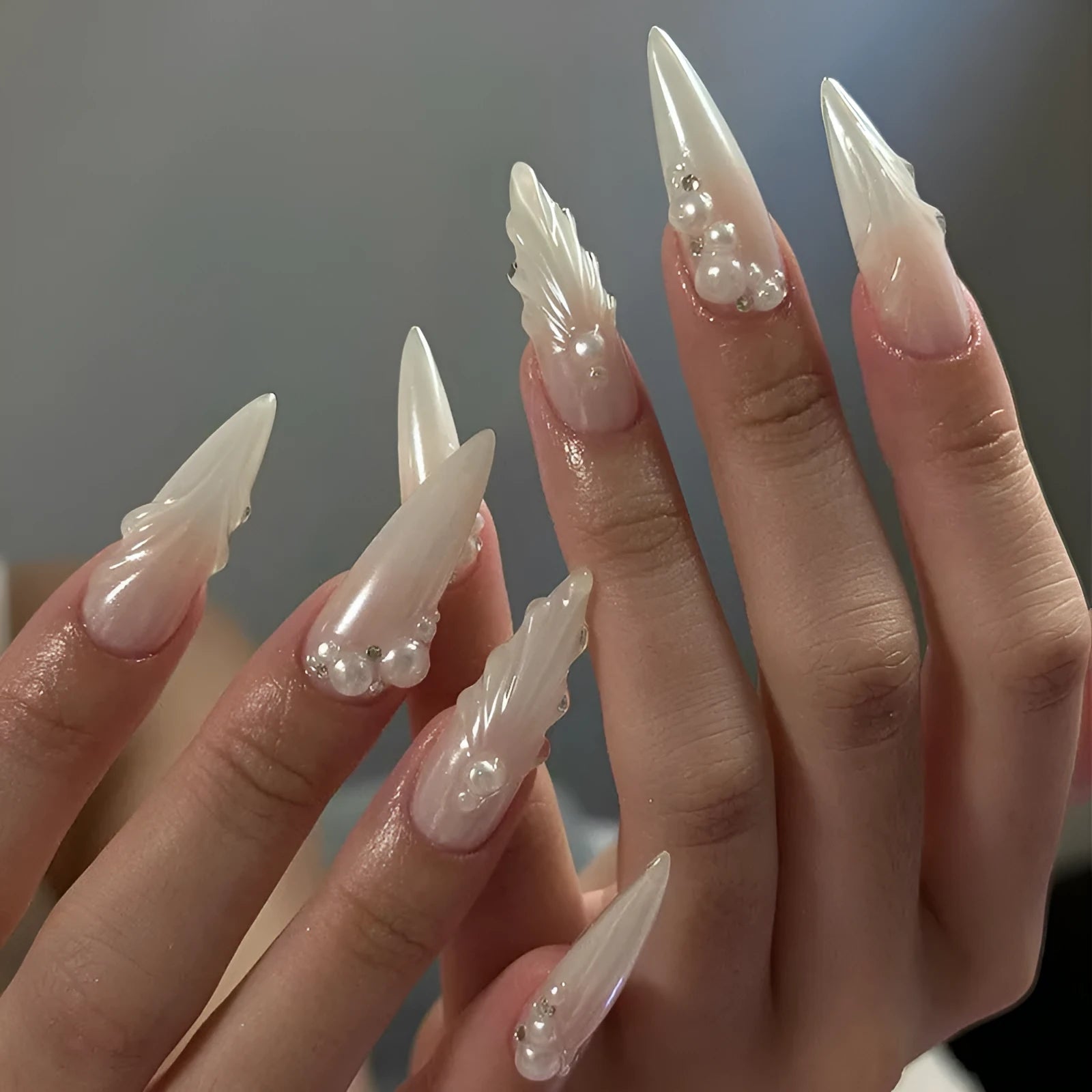24 pieces of white press-on artificial nail tips with diamond sparkle finish in a pack