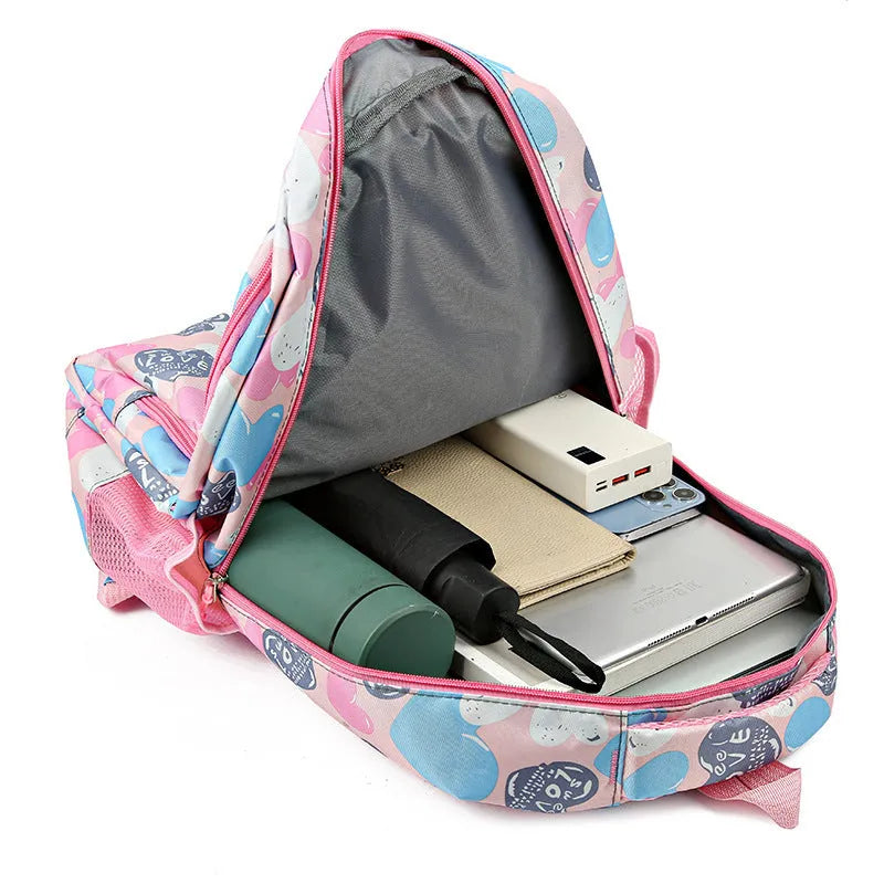 Blue student backpack with air cushion straps on a grey background, showing large main compartment.