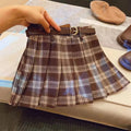 Children's plaid patterned pleated A-line skirt in cotton blend fabric.