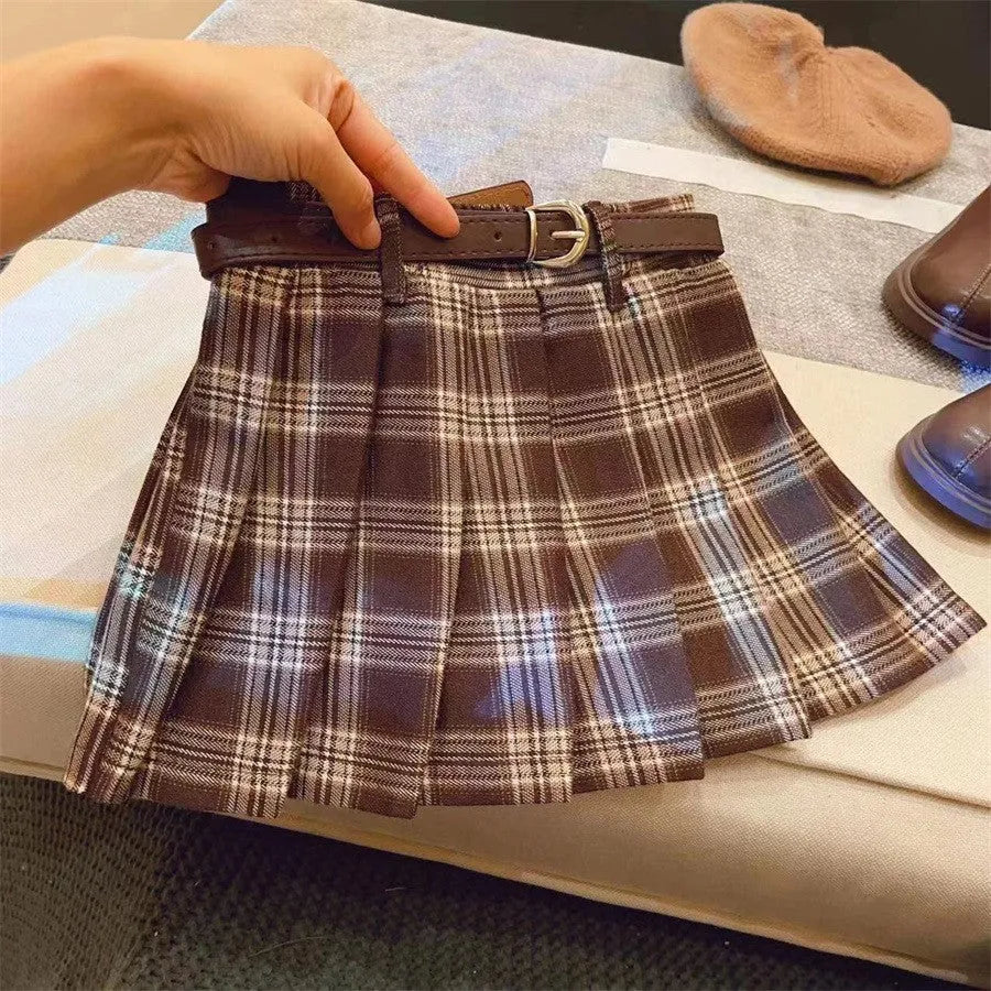 Children's plaid patterned pleated A-line skirt in cotton blend fabric.