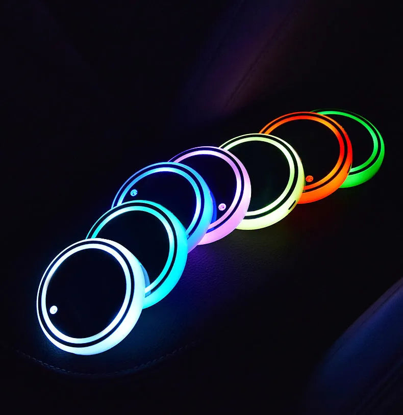 Colourful LED light-up coaster for car cup holder showing multiple light colours.