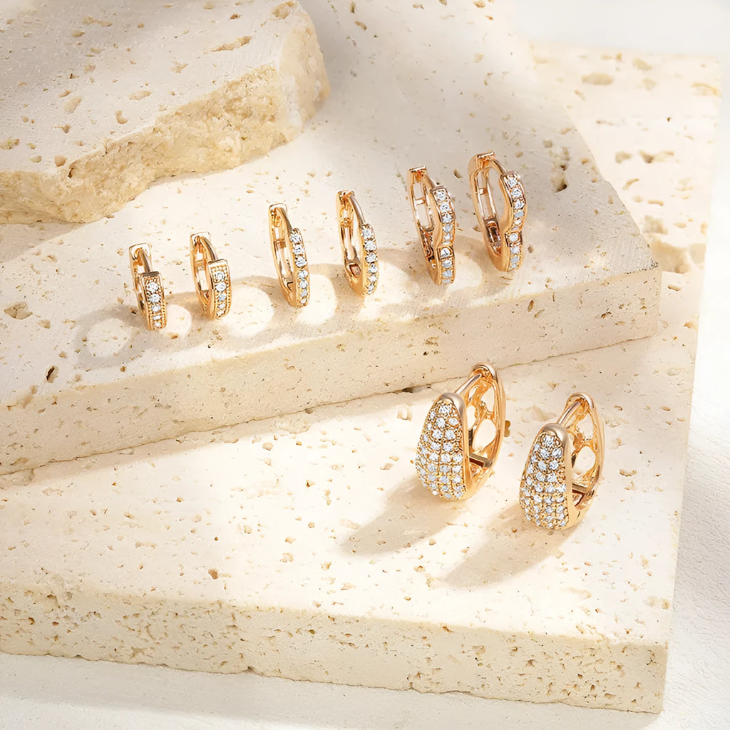 Brass gold plated heart-shaped ear clip earrings with zircon and gang drill details