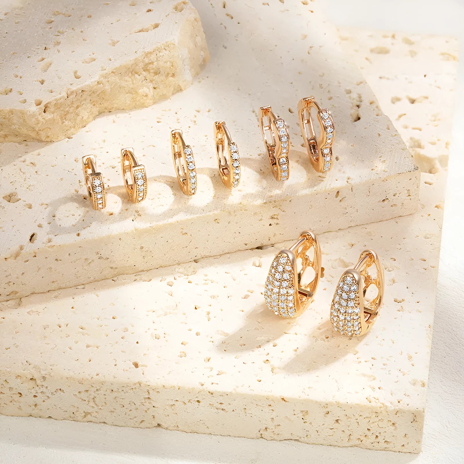 Brass gold plated heart-shaped ear clip earrings with zircon and gang drill details