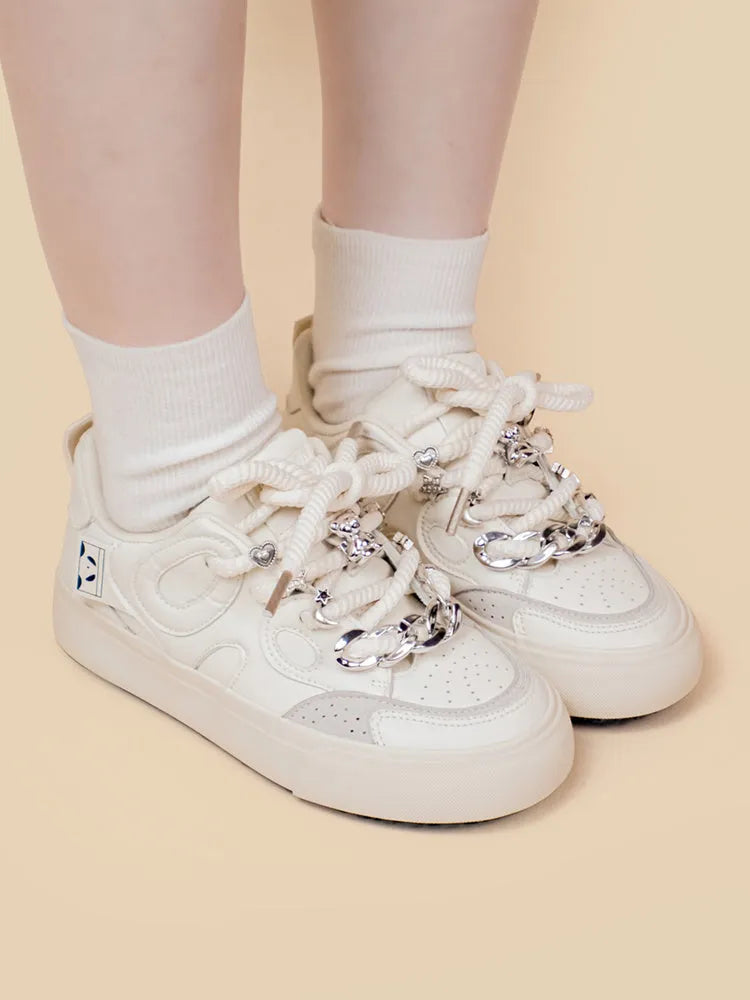 Casual white low-top lace-up sneakers for women with rubber sole and thick bottom heel