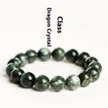Close-up of a green dragon crystal bead bracelet with round geometry beads and a Ruyi charm.