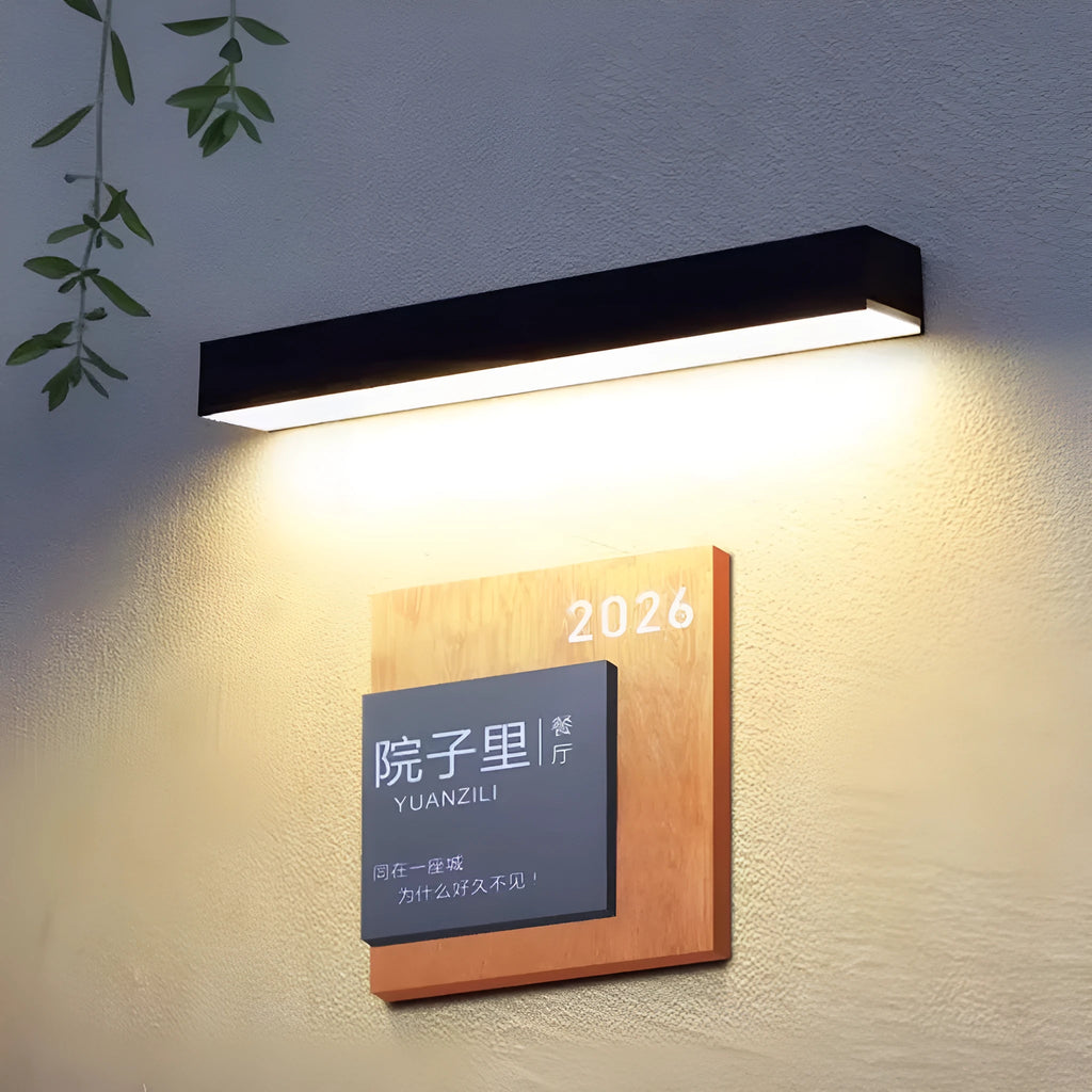 Black solar-powered outdoor wall lamp with strip design for garden and yard lighting