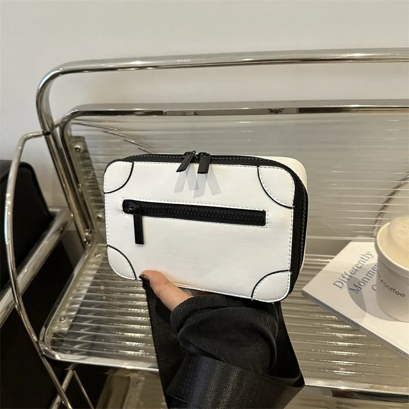 Small square black women's crossbody bag with single strap and external pockets