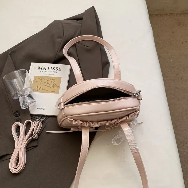 Women's PU leather shoulder handbag with removable bandage bow and phone compartment in milky white