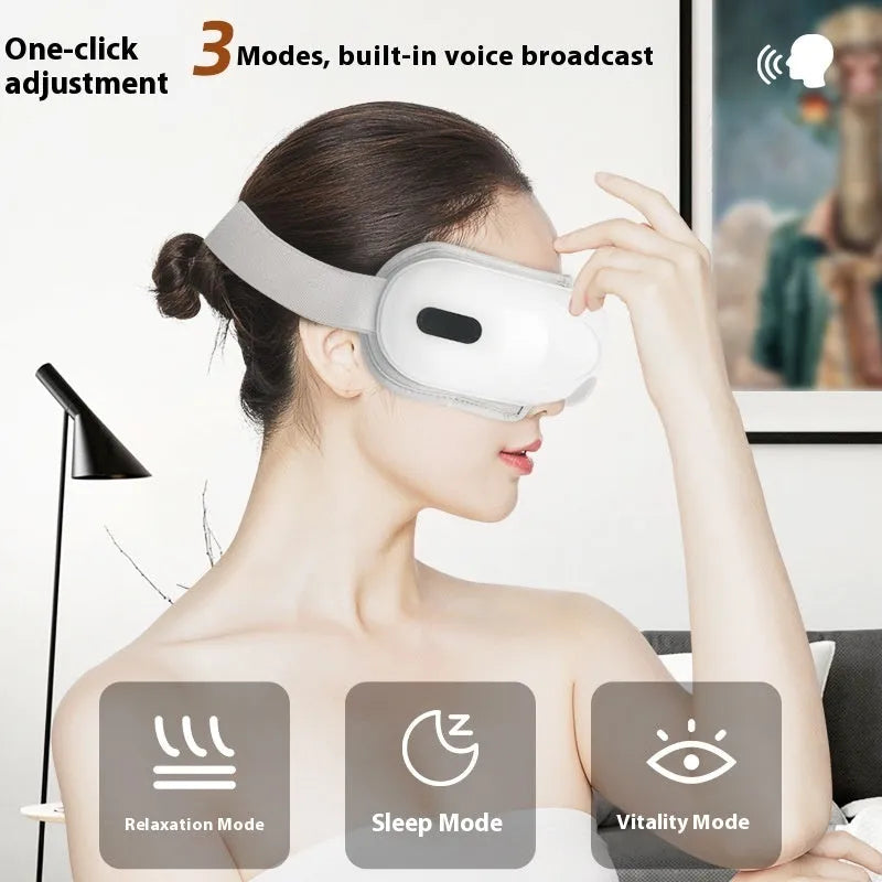 White rechargeable airbag eye massager with heat compression on a plain background