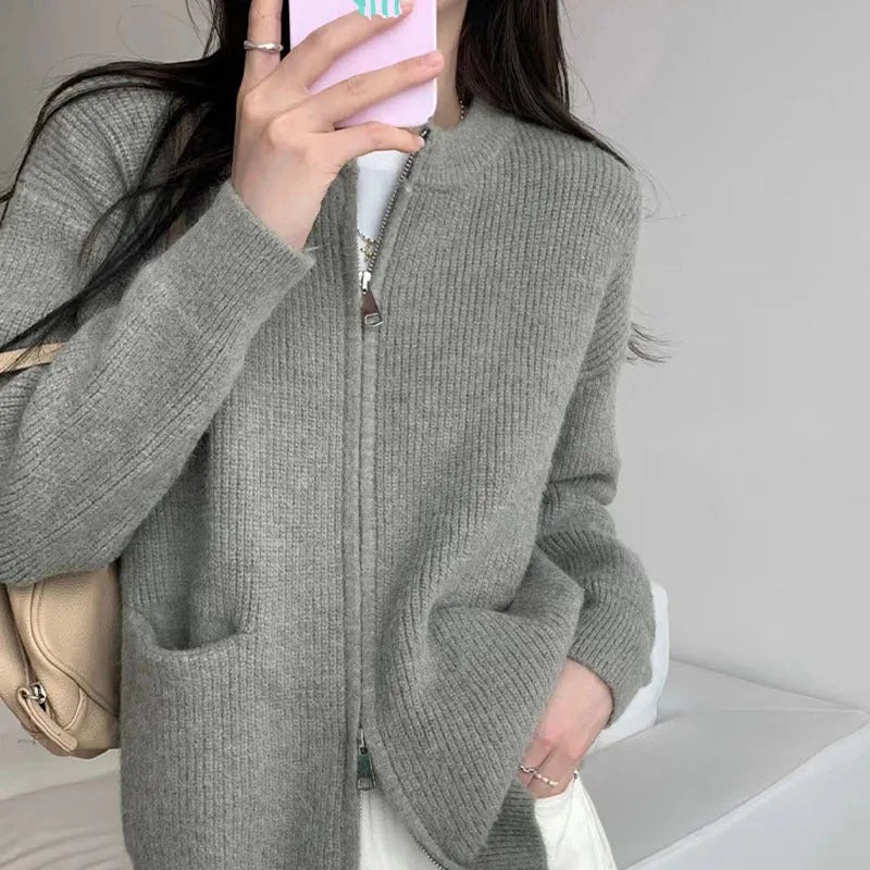 Beige viscose fibre long sleeve sweater coat cardigan laid flat.