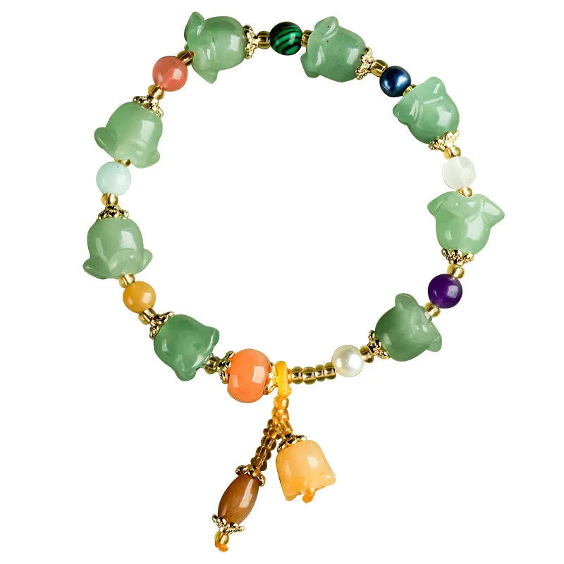 Natural Xinjiang Jinsi Jade bracelet with carved orchid beads in aventurine orchid colour.