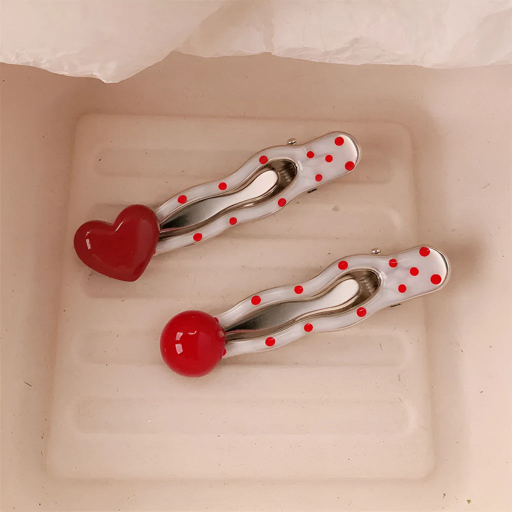 Red heart-shaped hair clip with retro dot patterns and willow leaf clip design