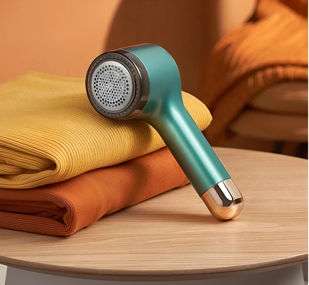 USB rechargeable hair ball trimmer for removing fabric pills from clothing and sofas.