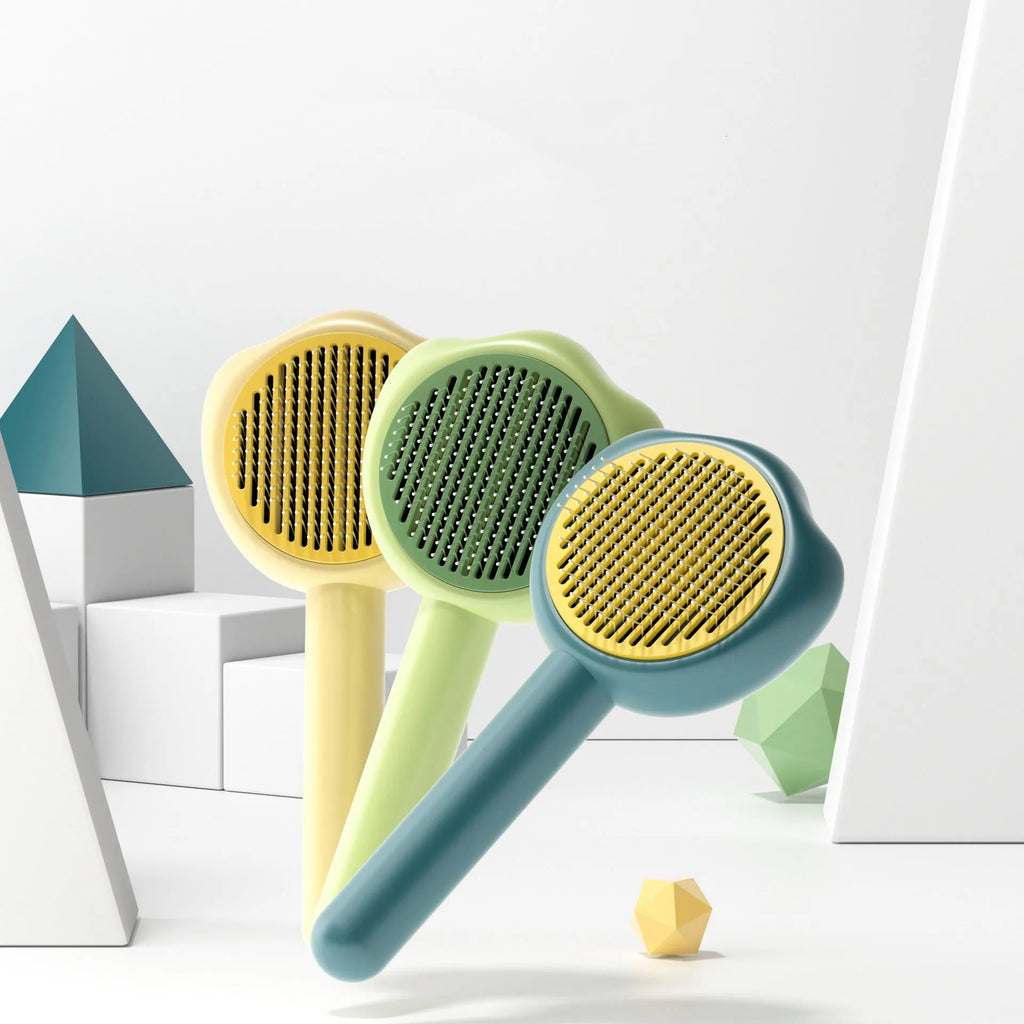 Blue self-cleaning pet grooming comb for cats with push-button mechanism and ergonomic handle